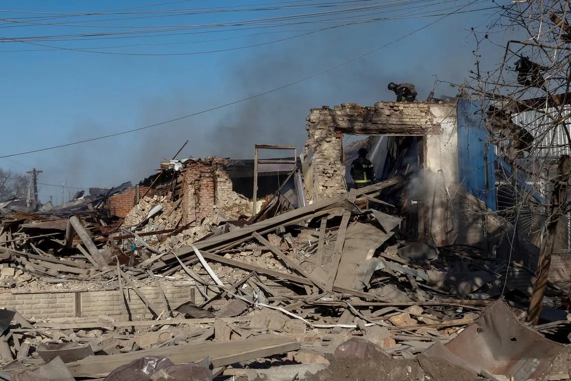 FILE PHOTO: Rescuers work at the site of Russian air strikes, amid Russia's attack on Ukraine, in the village of Lyptsi, Kharkiv region, Ukraine April 10, 2024.  REUTERS/Volodymyr Pavlov/File Photo