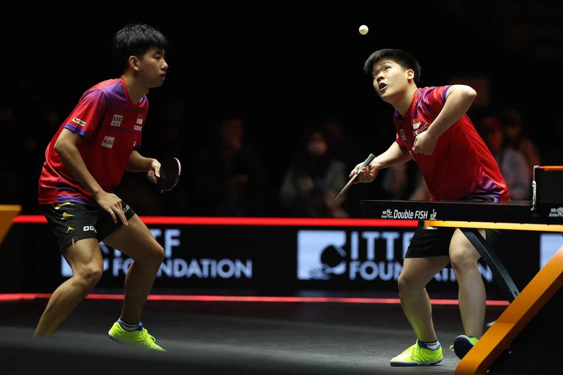 Singapore's 10th-ranked Koen Pang (left) and Izaac Quek pulled of a sensational 3-0 win over China's world No. 1 and defending champions Yuan Licen and Xiang Peng in the WTT Finals men's doubles quarter-final on Nov 20, 2024. 