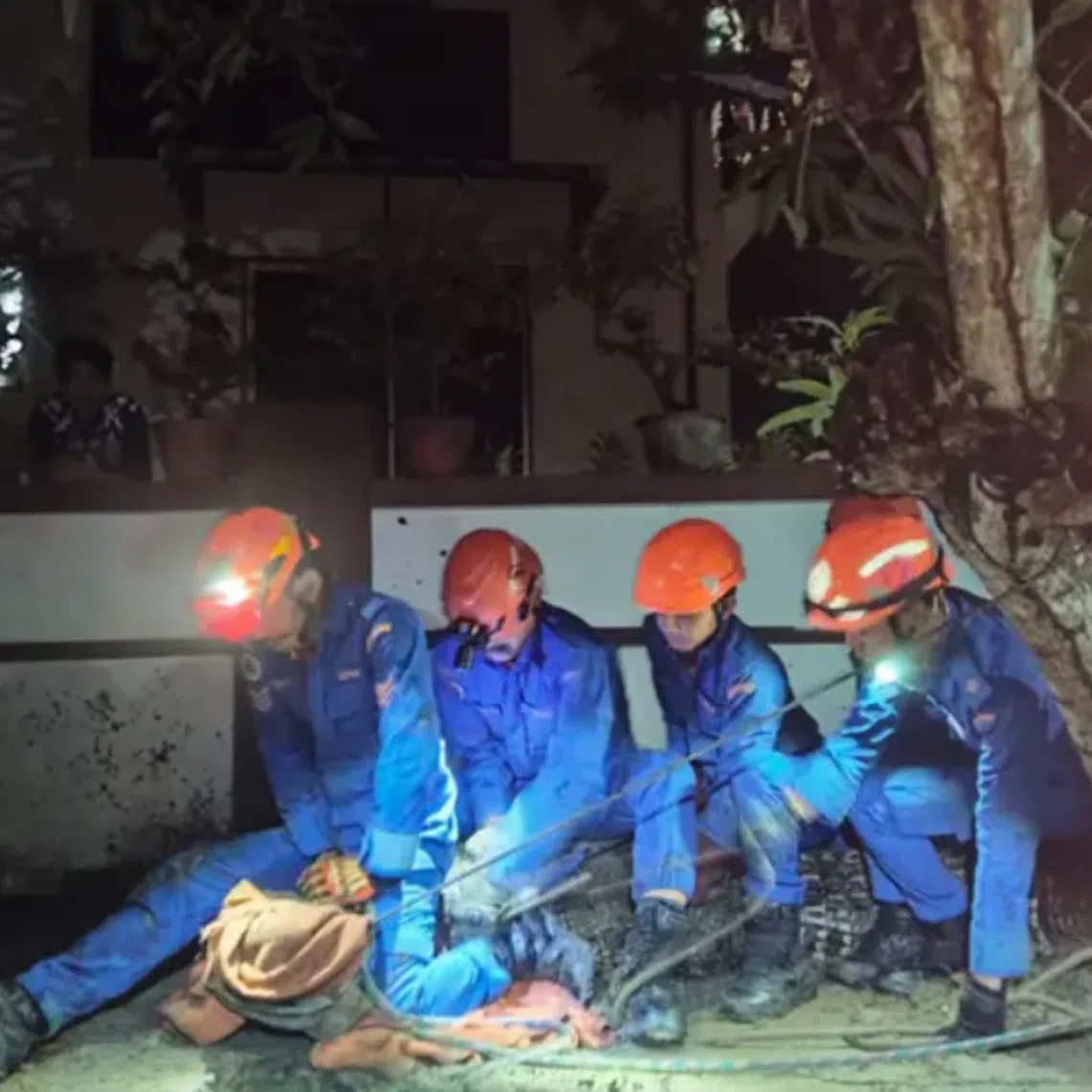 The district operations control centre received an emergency call about a crocodile seen emerging from beneath a stilt house after chasing a dog.