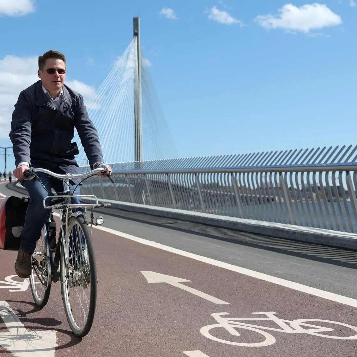 Team Leader of Bicycle Traffic, Oskari Kaupinmaki, rides his bike in Helsinki, Finland, May 5, 2026. REUTERS/Leonhard Foeger