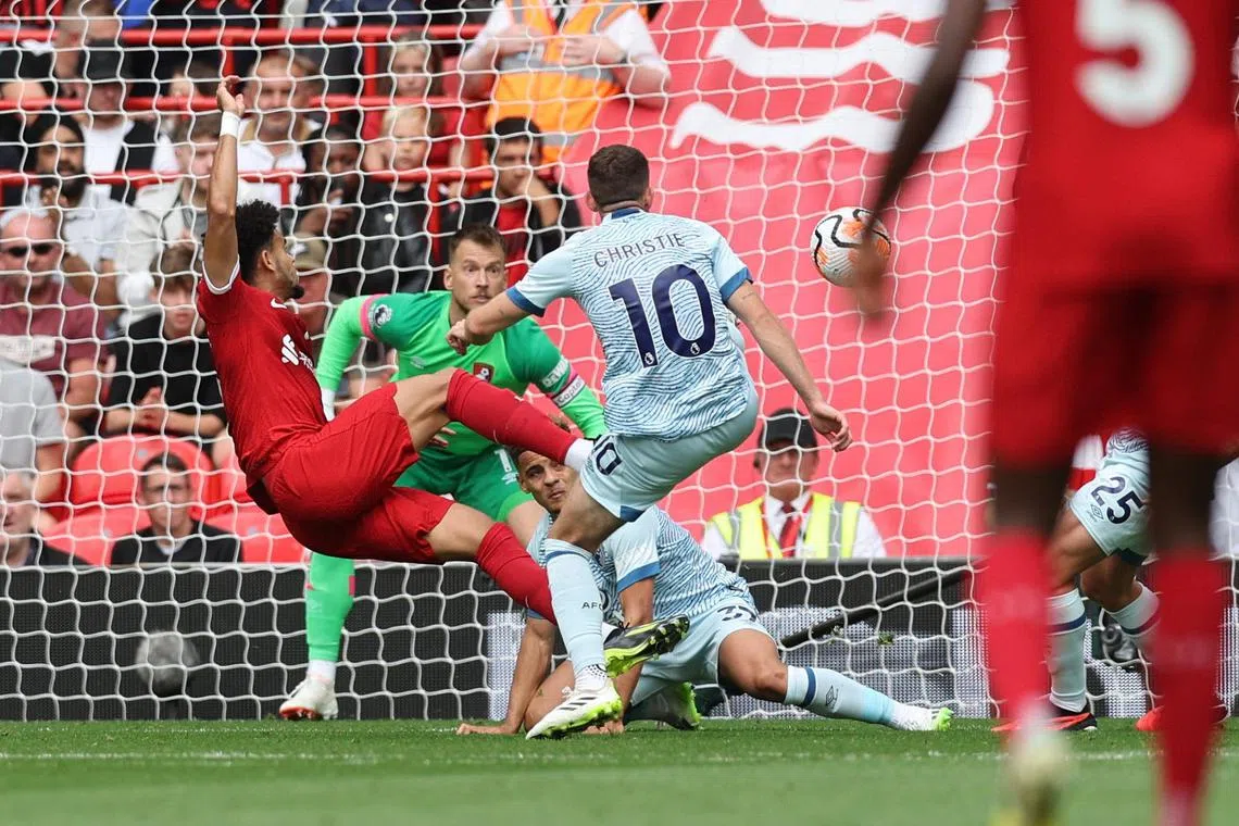Luis Diaz scoring Liverpool's equaliser past Bournemouth's Neto at Anfield on Sunday. The Reds won the English Premier League clash 3-1 on Sunday. 