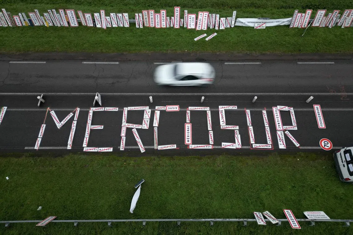 FILE PHOTO: A drone view shows the word \"Mercosur\" made with city signs on a road as French farmers protest against the prospect of a trade agreement between the European Union (EU) and the Latin American countries united within Mercosur, near Angouleme, France, November 18, 2024.  REUTERS/Stephane Mahe/File Photo