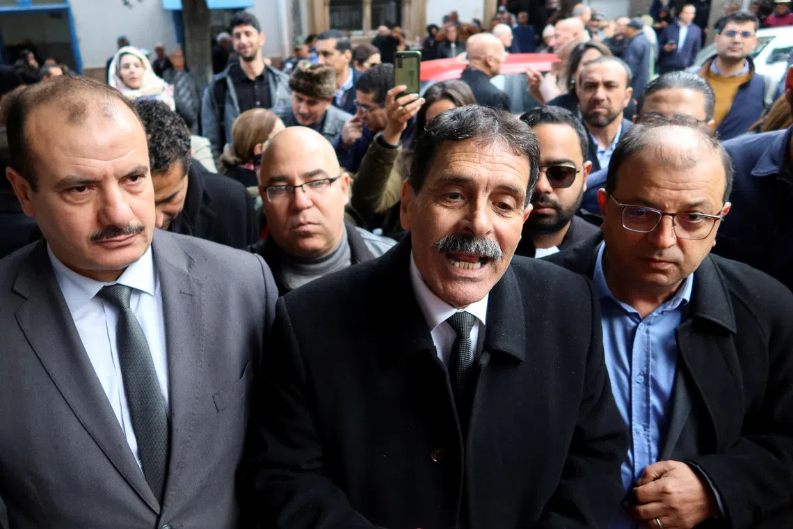 FILE PHOTO: Tunisian prominent activist, Ayachi Hammami, speaks outside a court in Tunis, Tunisia January 10, 2023. REUTERS/Jihed Abidellaoui/File Photo