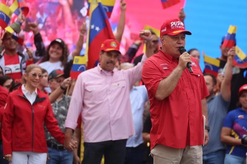 Venezuelan Minister of Interior and Justice Diosdado Cabello, standing in front of President Nicolas Maduro and his wife Cilia Flores, speaking during a rally in Caracas, Venezuela, on Dec 1.