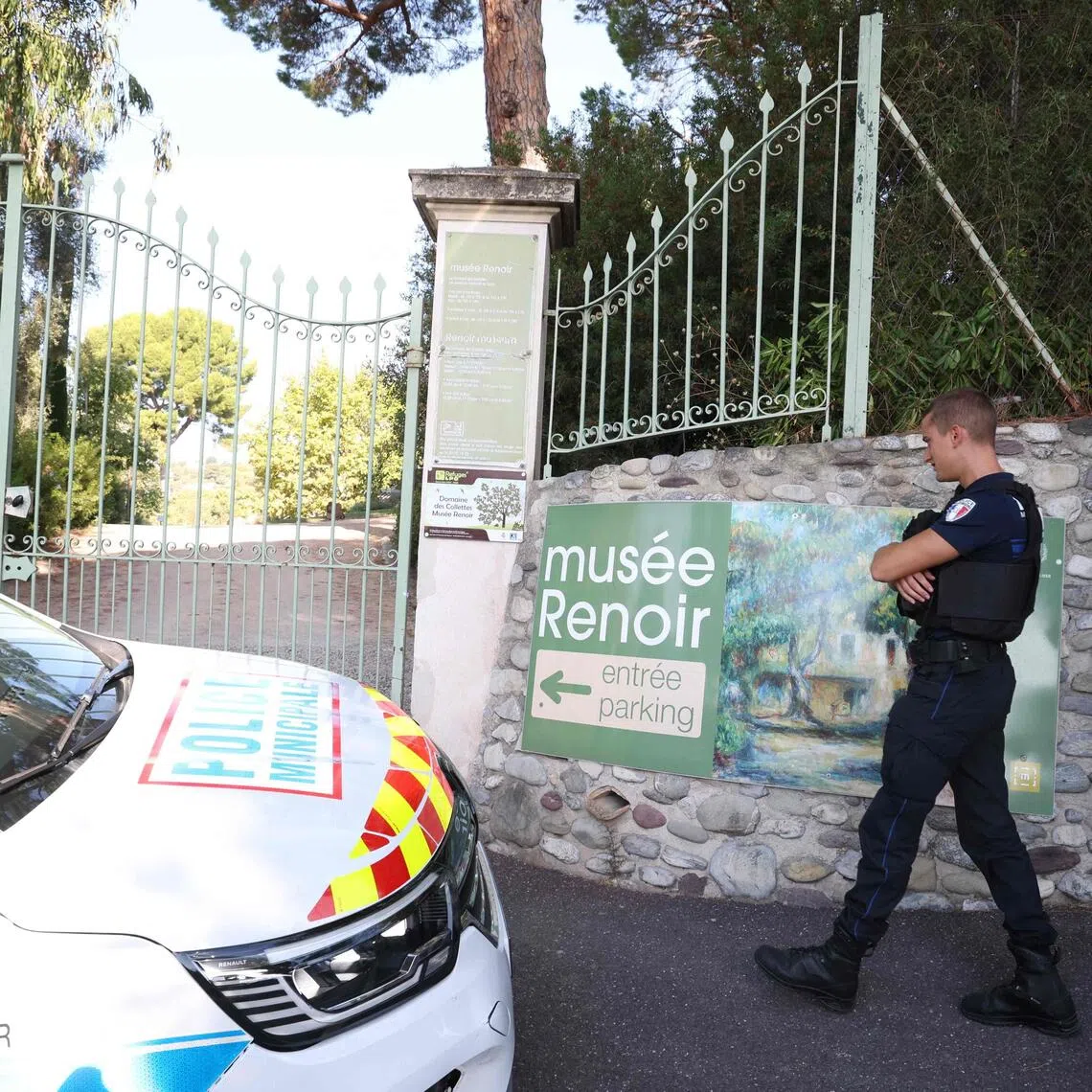 Police officers patrolling in front of the entrance of the Renoir Museum after four paintings, two of which were left behind, were stolen from the museum in an early-morning break-in.