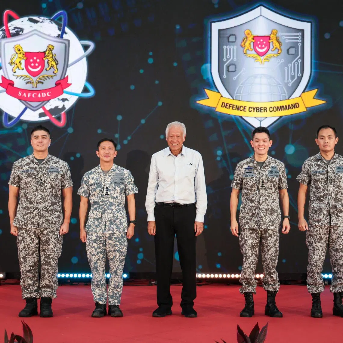 Defence Minister Ng Eng Hen with (from left) Commander of SAF C4 and Digitalisation Command Wong Hong Kai; Chief of Defence Force Aaron Beng; Chief of Digital and Intelligence Service Lee Yi-Jin; and Commander of Defence Cyber Command Clarence Cai on March 18.
