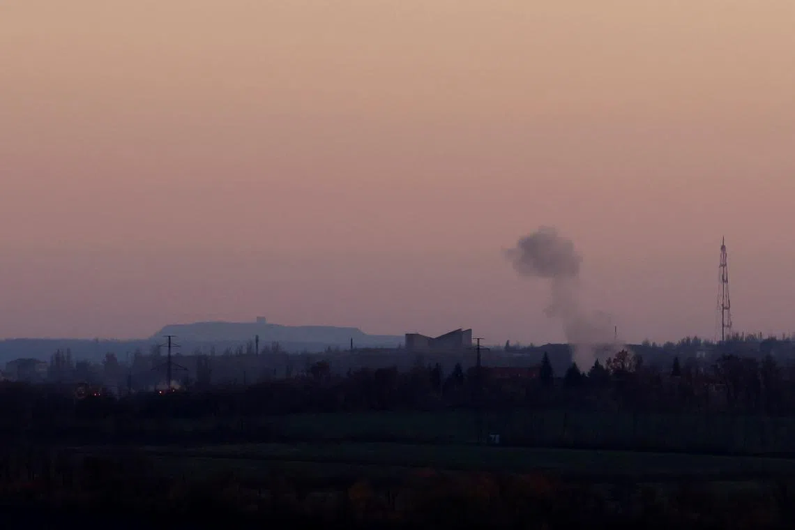 A plume of smoke rises from a missile strike at sunset, as Russia's invasion of Ukraine continues, in the eastern Donbas region of Bakhmut, Ukraine, November 1, 2022. REUTERS/Clodagh Kilcoyne/File Photo
