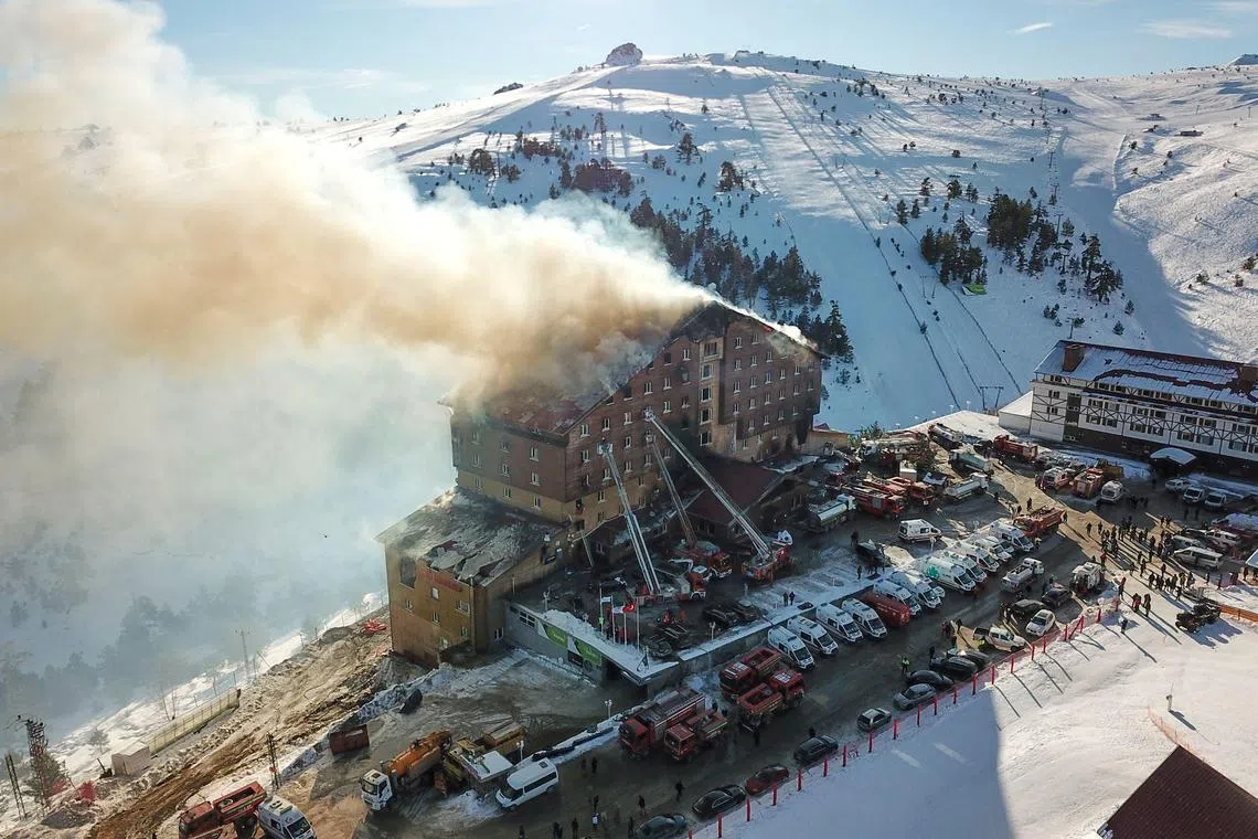 Firefighters battle a fire tearing through the Grand Kartal Hotel in Kartalkaya, Turkey on Jan 21.