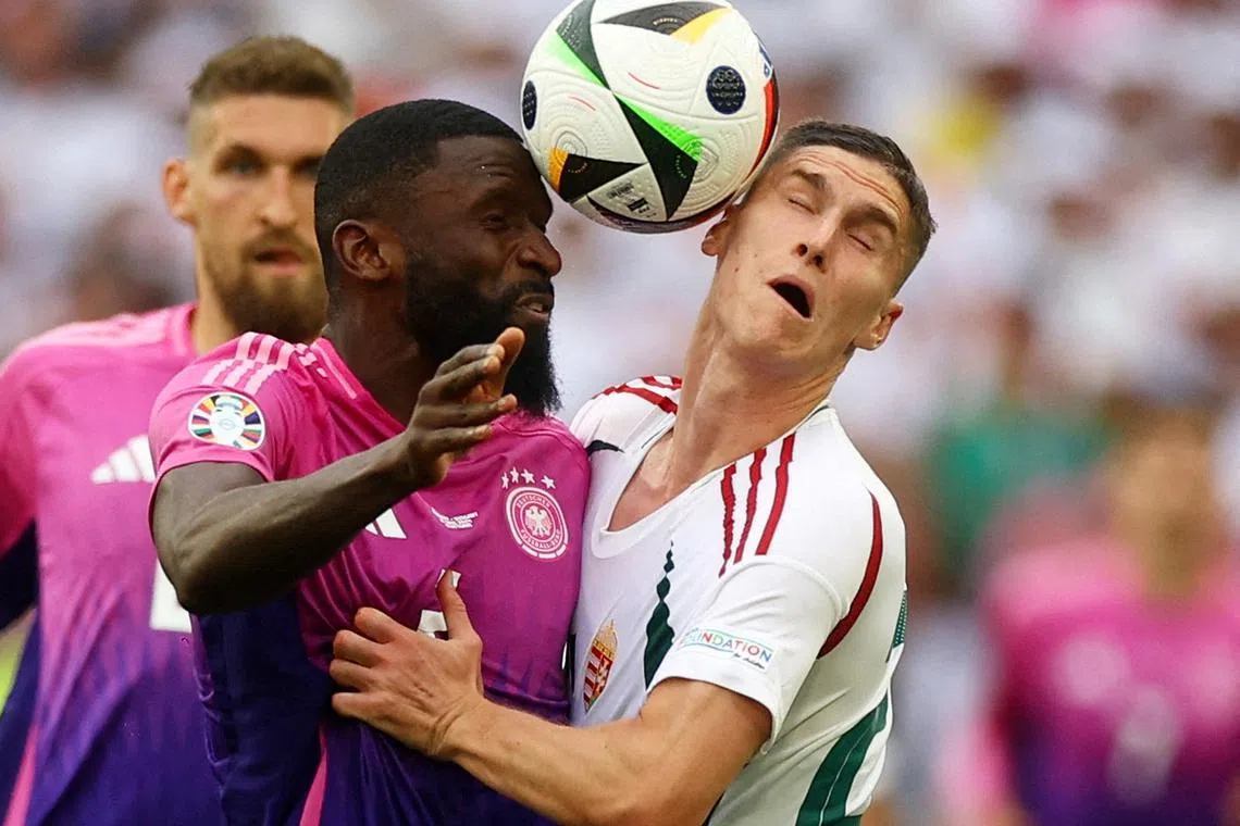 Germany's Antonio Rudiger in action with Hungary's Roland Sallai during the Euro 2024, Group A match between Germany and Hungary held at the Stuttgart Arena, in Stuttgart, Germany, on June 19, 2024.