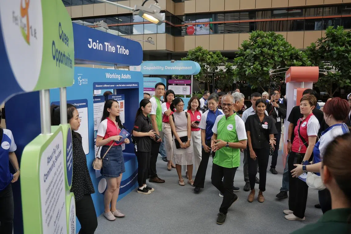 Minister of Social and Family Development Masagos Zulkifli (in green) attends the Social Service Tribe Festival on Feb 23.