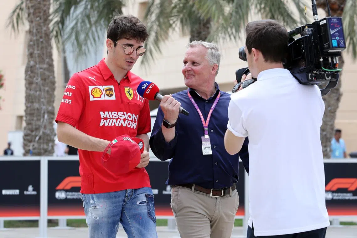 FILE PHOTO: Formula One F1 - Bahrain Grand Prix - Bahrain International Circuit, Sakhir, Bahrain - March 30, 2019  Former driver Johnny Herbert interviews Ferrari's Charles Leclerc  REUTERS/Hamad I Mohammed/File Photo