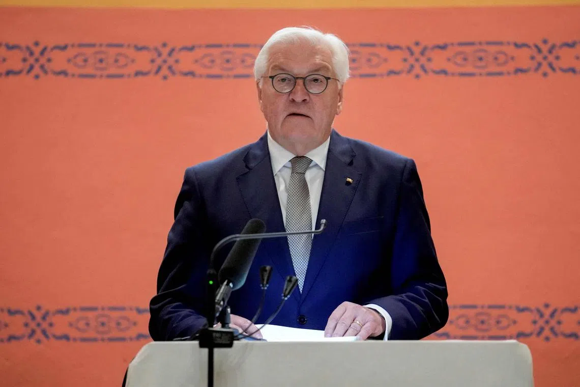 German President Frank-Walter Steinmeier addresses guests during an Iftar dinner at the Wilmersdorf mosque, during the Muslim holy month of Ramadan in Berlin on March 12, 2025. The German President visited the mosque to mark its centenary and took part in the breaking of the fast. (Photo by Ebrahim Noroozi / POOL / AFP)