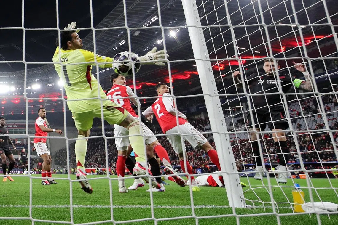 Soccer Football - UEFA Champions League - Round 16 - First Leg - Bayer Leverkusen v Arsenal - BayArena, Leverkusen, Germany - March 11, 2026 Bayer Leverkusen's Robert Andrich scores their first goal past Arsenal's David Raya REUTERS/Thilo Schmuelgen