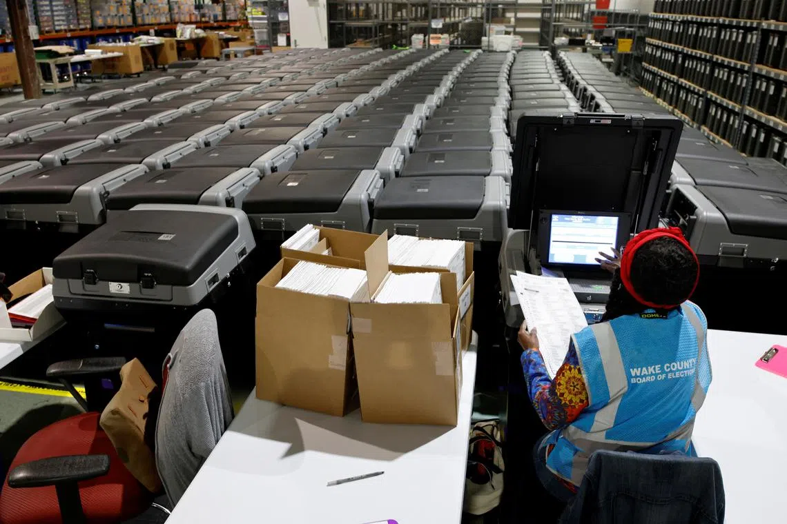 A precinct official testing voting machines ahead of the upcoming general election in Raleigh, North Carolina, on Sept 5.