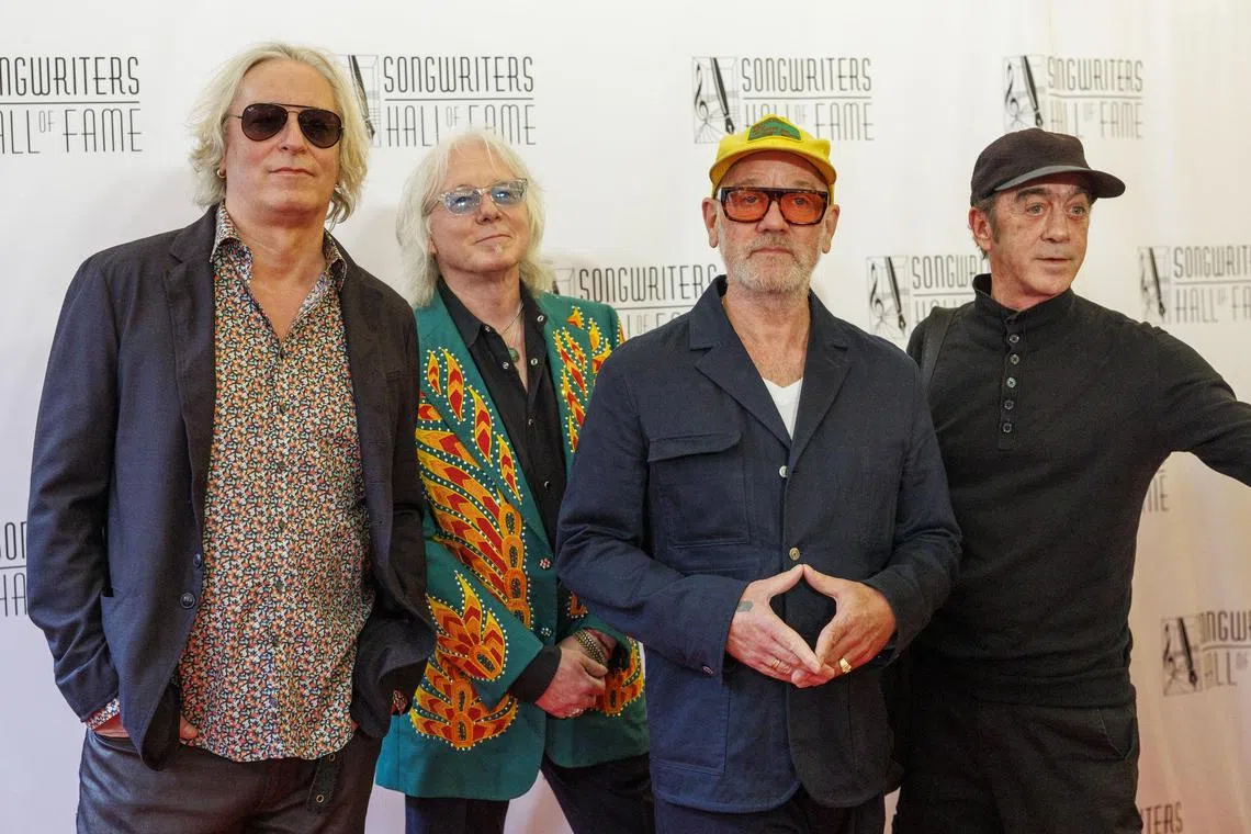 American musicians and rock band members of R.E.M. (left to right) Peter Buck, Mike Mills, Michael Stipe and Bill Berry attend the Songwriters Hall of Fame red carpet at the New York Marriott Marquis Hotel in New York on June 13, 2024. 