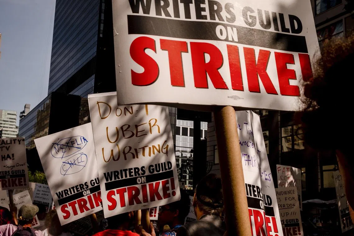 Members of the Writers Guild of America picket outside of the Fox News advertiser Upfront Event, in New York on May 15.