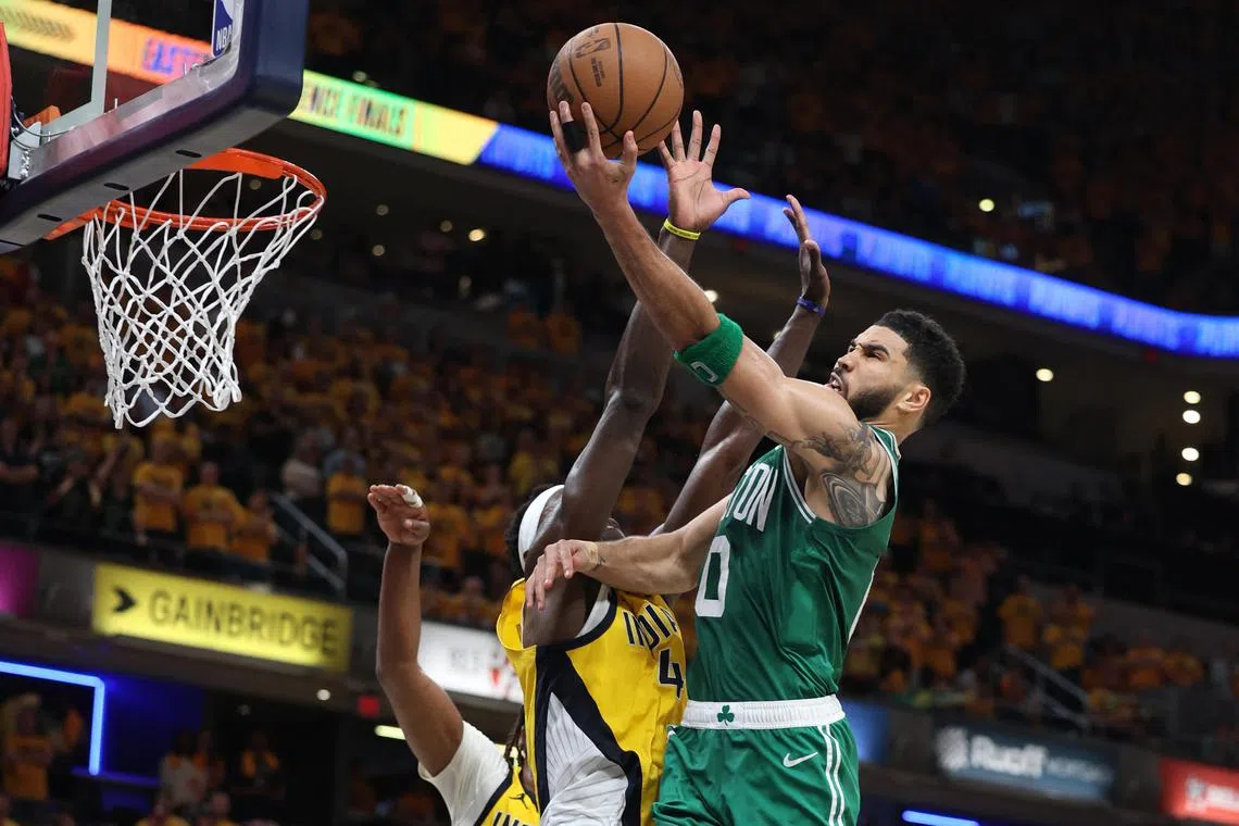 Boston Celtics forward Jayson Tatum shoots the ball against Indiana Pacers forward Pascal Siakam during the fourth quarter of Game 3 of the NBA Eastern Conference Finals.