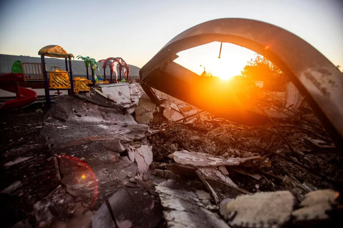 A playground melted and destroyed by fire is seen in a burnt area as the Eaton Fire, one of several simultaneous blazes ripping across Los Angeles County continues, in Altadena, California, U.S., January 14, 2025. REUTERS/Ringo Chiu     TPX IMAGES OF THE DAY     