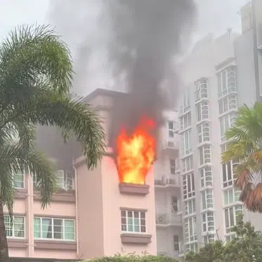 Footage circulating on social media shows flames flaring out of a residential unit’s window.