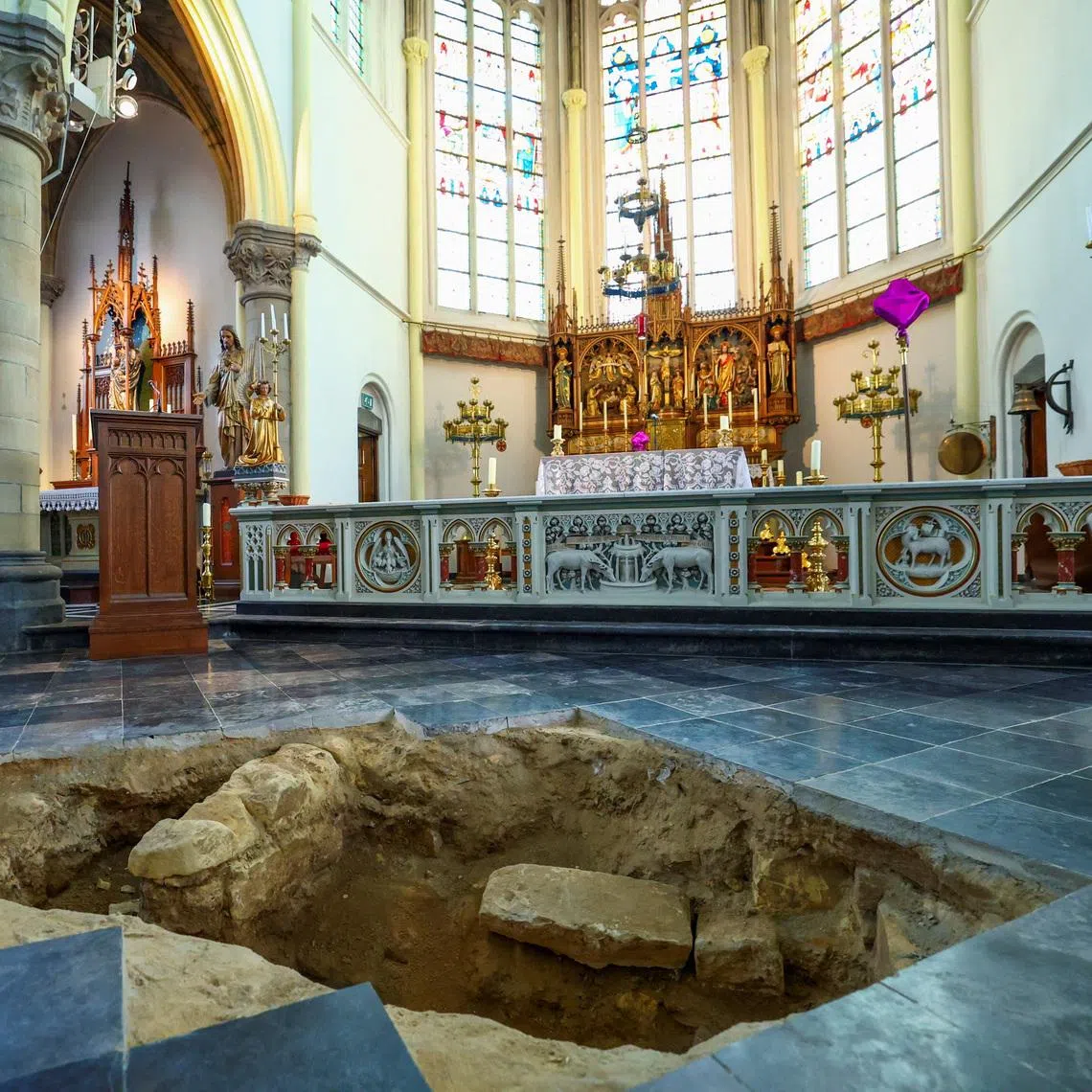A view inside the Peter and Paul Church (Petrus en Pauluskerk) in Maastricht shows an excavation pit opened in the floor, where archaeologists believe they may have uncovered the skeletal remains of Charles de Batz de Castelmore, known as d’Artagnan, leader of King Louis XIV's musketeers, who died in 1673 during the French siege of the city, in Maastricht, Netherlands, March 25, 2026. REUTERS/Piroschka van de Wouw