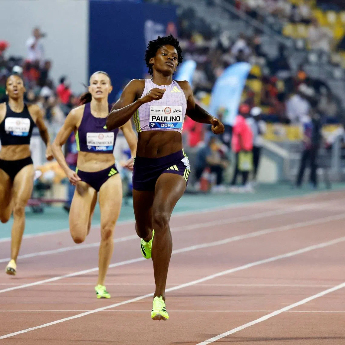 Athletics - Diamond League - Doha - Khalifa International Stadium, Doha, Qatar - June 19, 2026 Dominican Republic's Marileidy Paulino crosses the finish line to win the women's 400m final REUTERS/Ibraheem Abu Mustafa