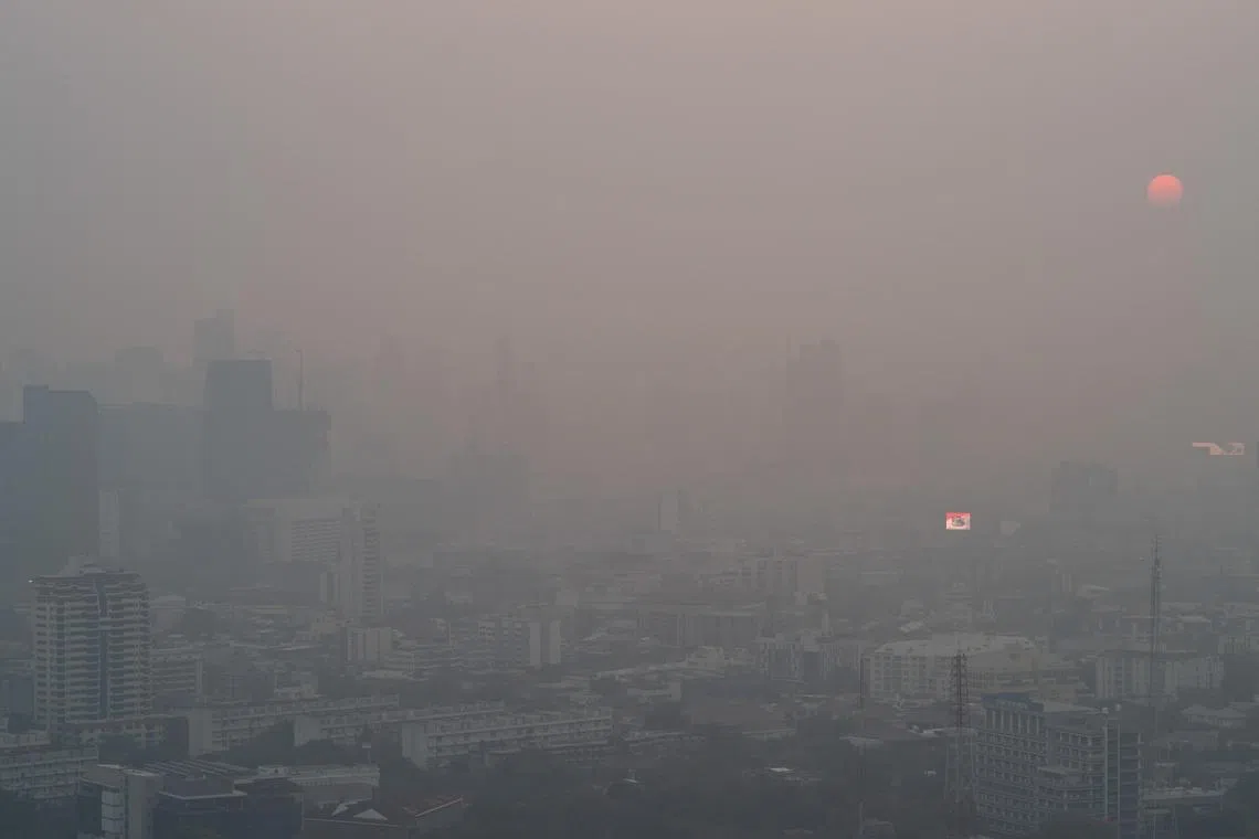 A view of the Bangkok city amid air pollution during sunrise.