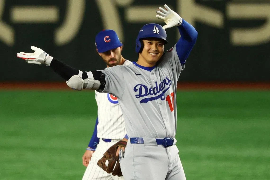 Los Angeles Dodgers' Shohei Ohtani reacts after hitting a double to reach second base during the ninth innings.