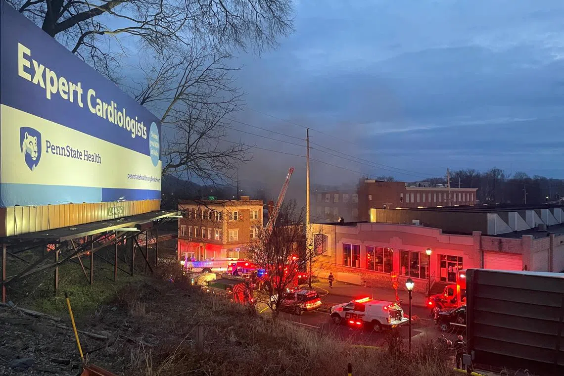 A general view shows smoke coming out from a chocolate factory after fire broke out, in West Reading, Pennsylvania, U.S., March 24, 2023 in this picture obtained from social media. Twitter @Based_In410/via REUTERS  THIS IMAGE HAS BEEN SUPPLIED BY A THIRD PARTY. MANDATORY CREDIT. NO RESALES. NO ARCHIVES.