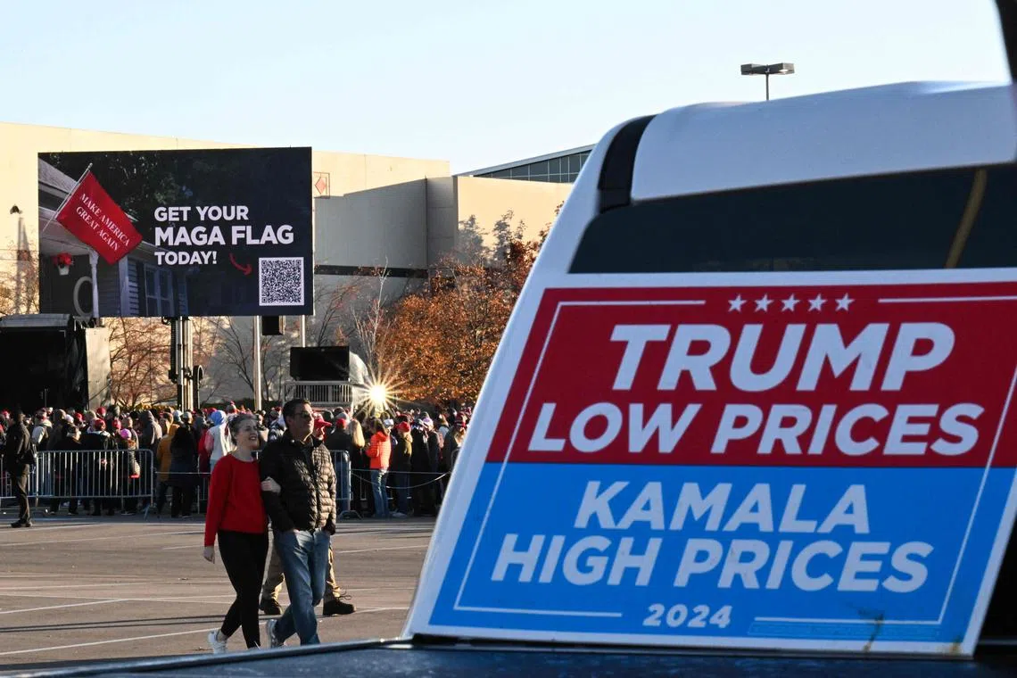 Supporters for former US President and Republican presidential candidate Donald Trump arrive for a campaign rally at the Suburban Collection Showplace in Novi, Michigan, on Oct 26, 2024.