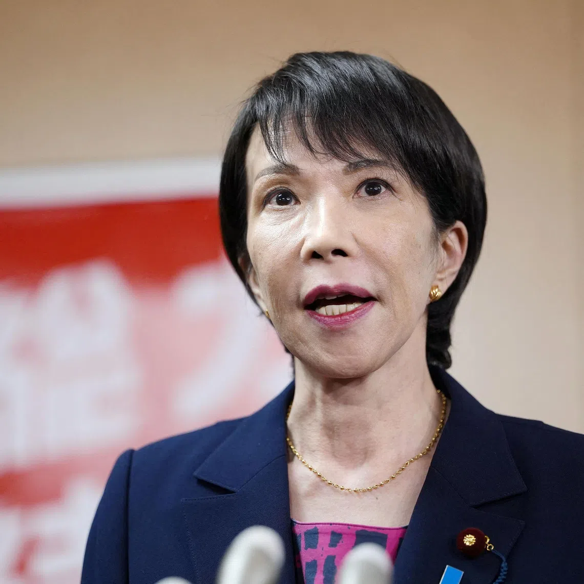 Japan's Liberal Democratic Party newly elected chief Sanae Takaichi speaks to media after a meeting with Japan's Komeito party leader Tetsuo Saito, at the party headquarters, in Tokyo, Japan October 10, 2025, in this photo taken by Kyodo. Kyodo/via REUTERS