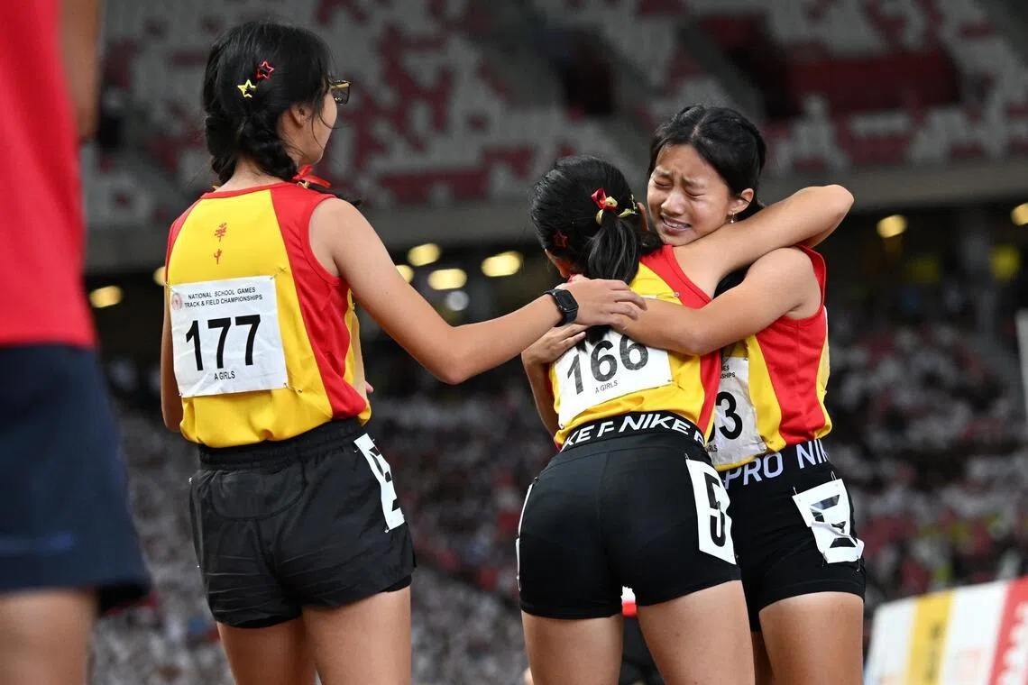From right: Hwa Chong Institution?s Choo Jiayi celebrating with her teammates Huang Tianai and Sun Lanning after winning the A Division girls' 4X400m relay in the National School Games SSC Track and Field Championship on April 17, 2026.
