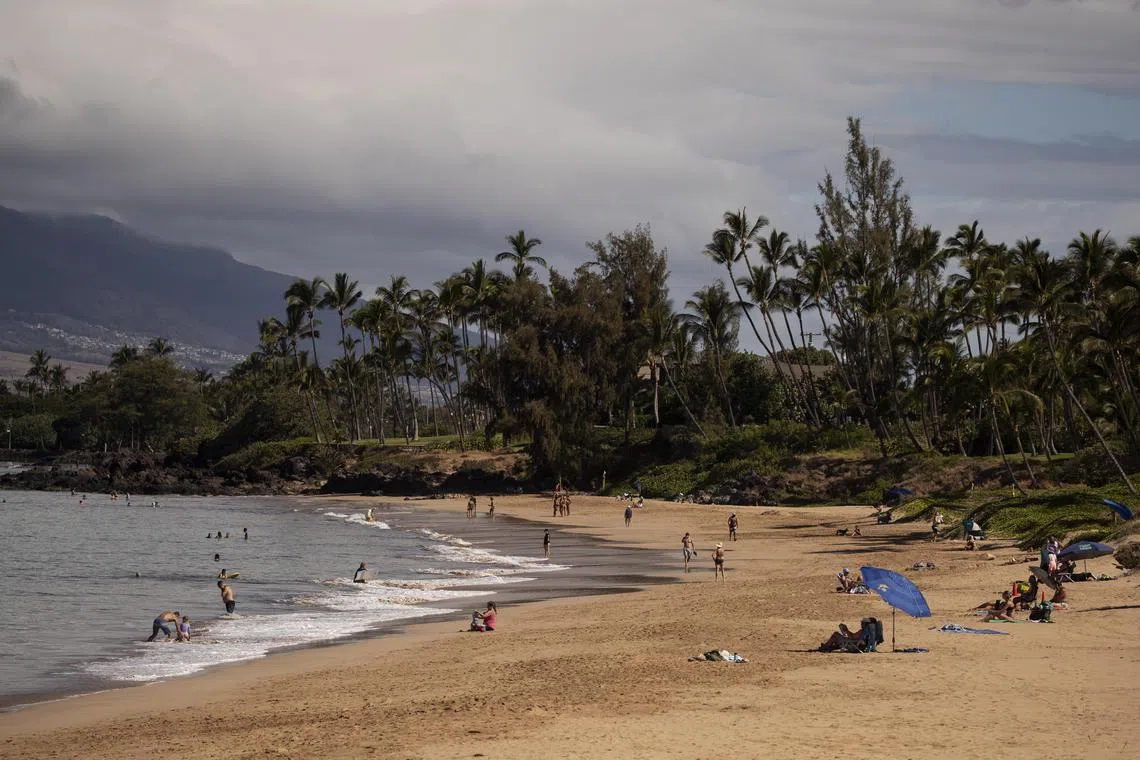 epa10801997 Tourists enjoy a day at the beach in Kihei, Maui, Hawaii, USA, 15 August 2023. Some tourist have stayed in Kihei, the coastal city located only 20 miles (32km) south of Lahaina. Many residents of Maui and especially inhabitants of Lahaina are upset and hurt when seeing tourists enjoying the same water in which so many of their fellow inhabitants died during the Lahaina Fire. At least 99 people were killed in the wildfires burning in Maui, which is considered the largest natural disaster in Hawaii's state history.  EPA-EFE/ETIENNE LAURENT