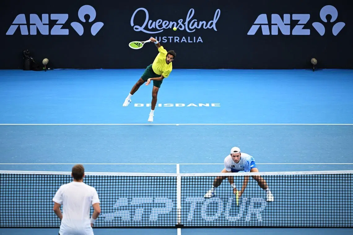 Tennis - Brisbane International Tennis Tournament - Pat Rafter Arena, Brisbane, Australia - January 11, 2026 Portugal's Francisco Cabral and Austria's Lucas Miedler in action during their men's doubles final against Britain's Julian Cash and Britain's Lloyd Glasspool REUTERS/Dan Peled