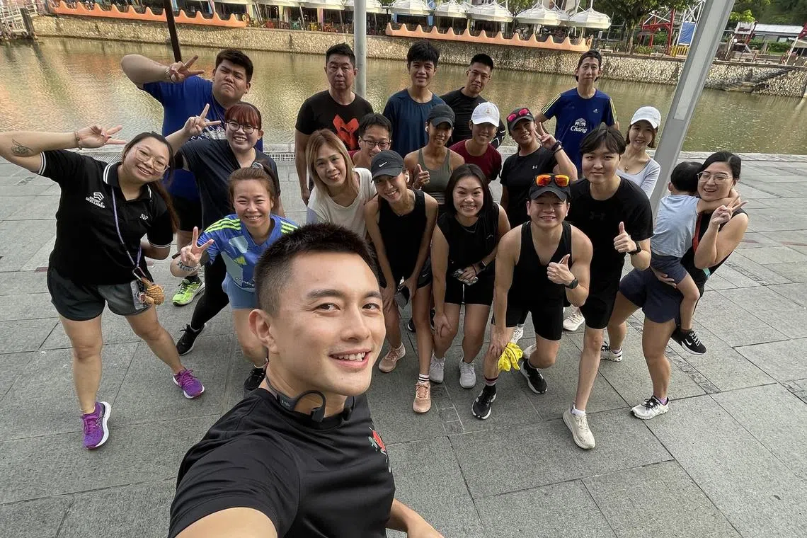 Local actor Shane Pow with some members of his Sunbaked Club, who ran in the Boat Quay and Clarke Quay areas on Oct 27.