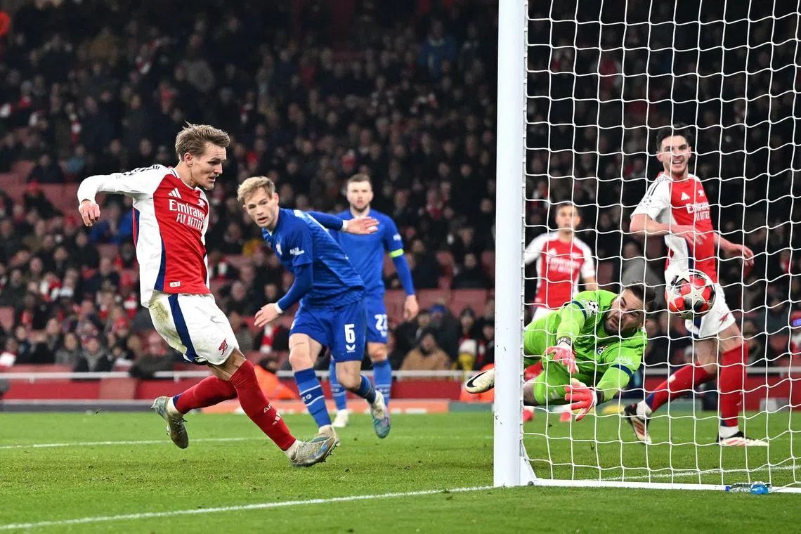 Arsenal's Martin Odegaard scoring his team's third goal against Dinamo Zagreb on Jan 22.