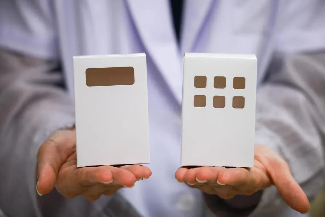 Tan Tock Seng Hospital pharmacists designed a single-material paper medication box (right), removing the plastic component of the old box (left), and making it recyclable in NEA’s blue recycling bins.