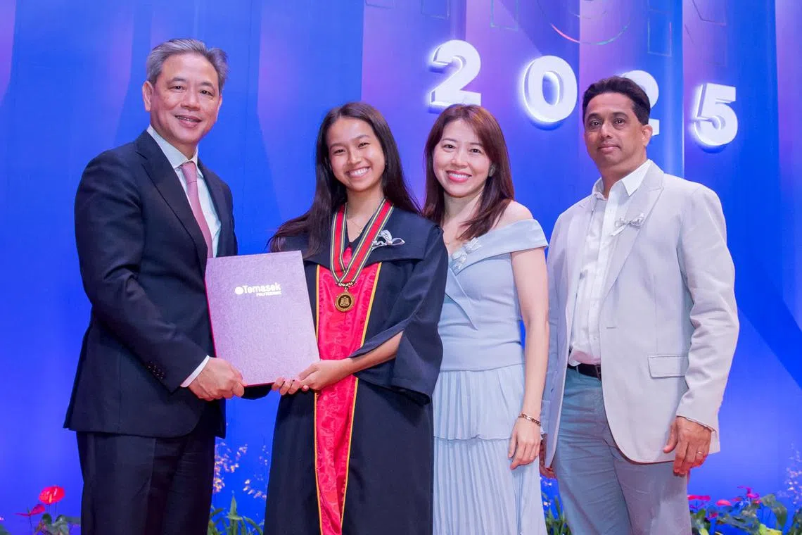 dltpgrad - Ms Portia Gabrielle Karl with her parents at her Temasek Polytechnic graduation ceremony.



Credit: Temasek Polytechnic