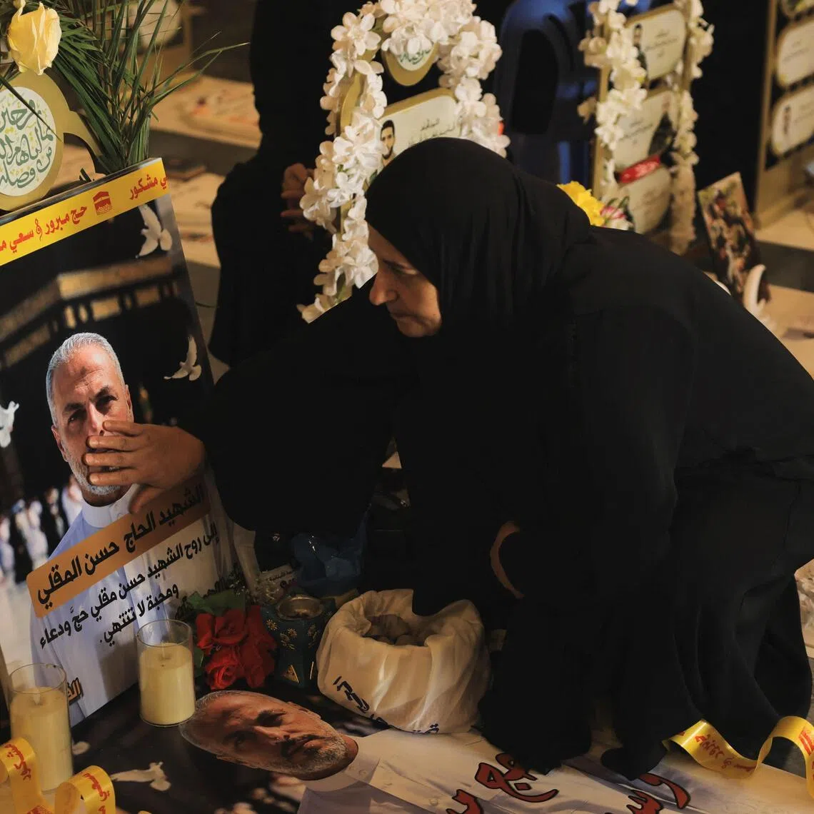A woman visits the graves of her loved ones on Eid al-Adha – the Great Day of Sacrifice – in Beirut’s southern suburbs.
