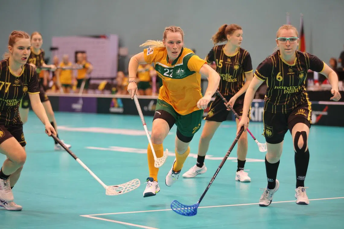 Australia’s Amanda Bartrim (No. 22) playing in the 10-0 loss to Germany at the Women’s World Floorball Championship at OCBC Arena on Dec 2, 2023.