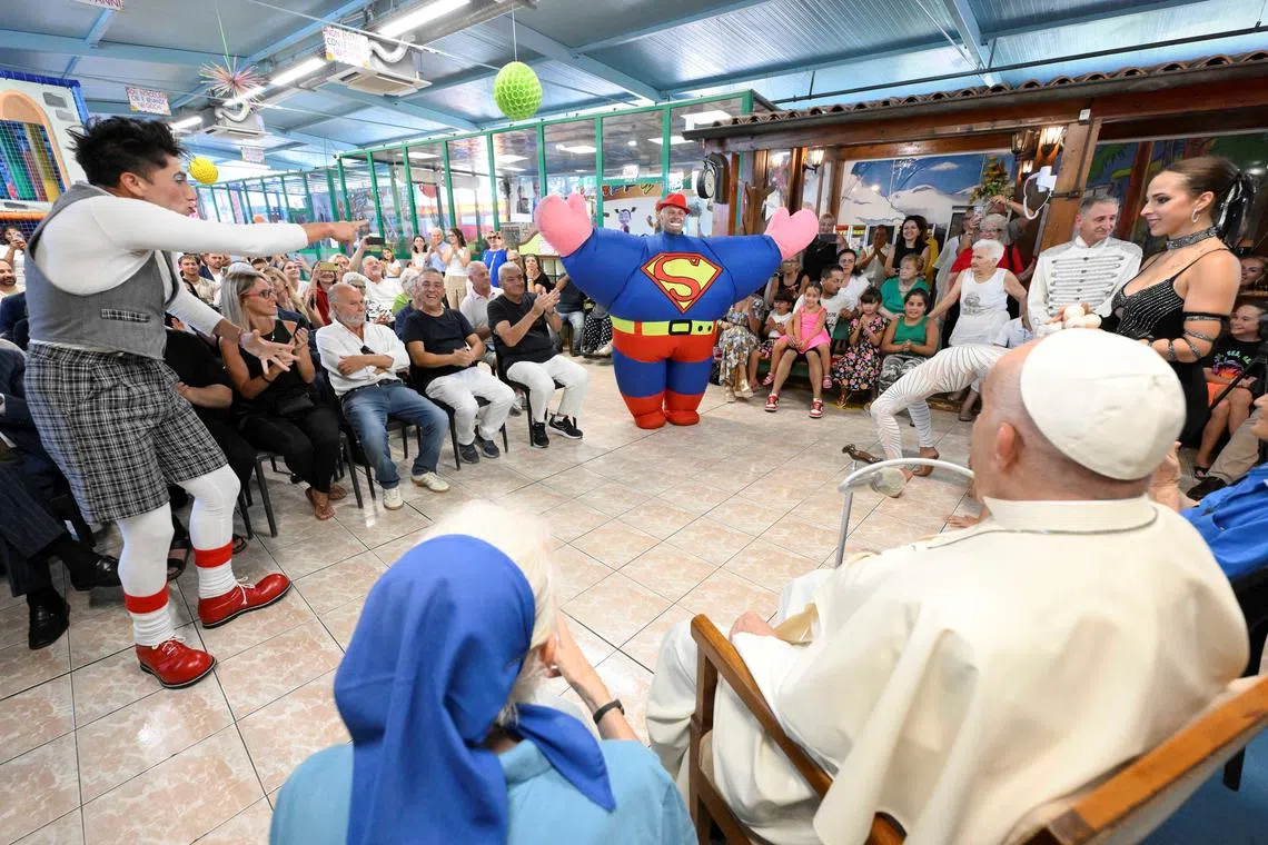 Pope Francis meets Sister Genevieve Jeanningros and the Community of carousers and circus performers at the Luna Park in Ostia Lido, Italy, July 31, 2024.   Vatican Media/­Handout via REUTERS