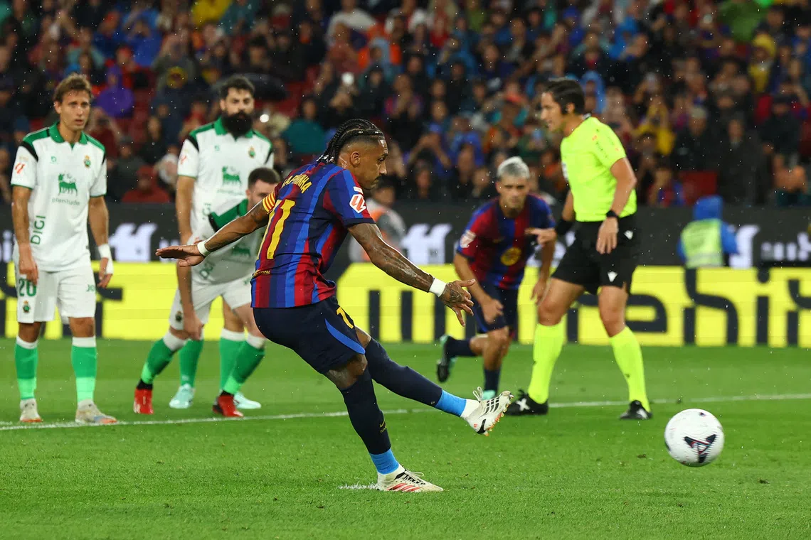 Flick sets record as Barcelona breeze past Racing with Raphinha hat-trick