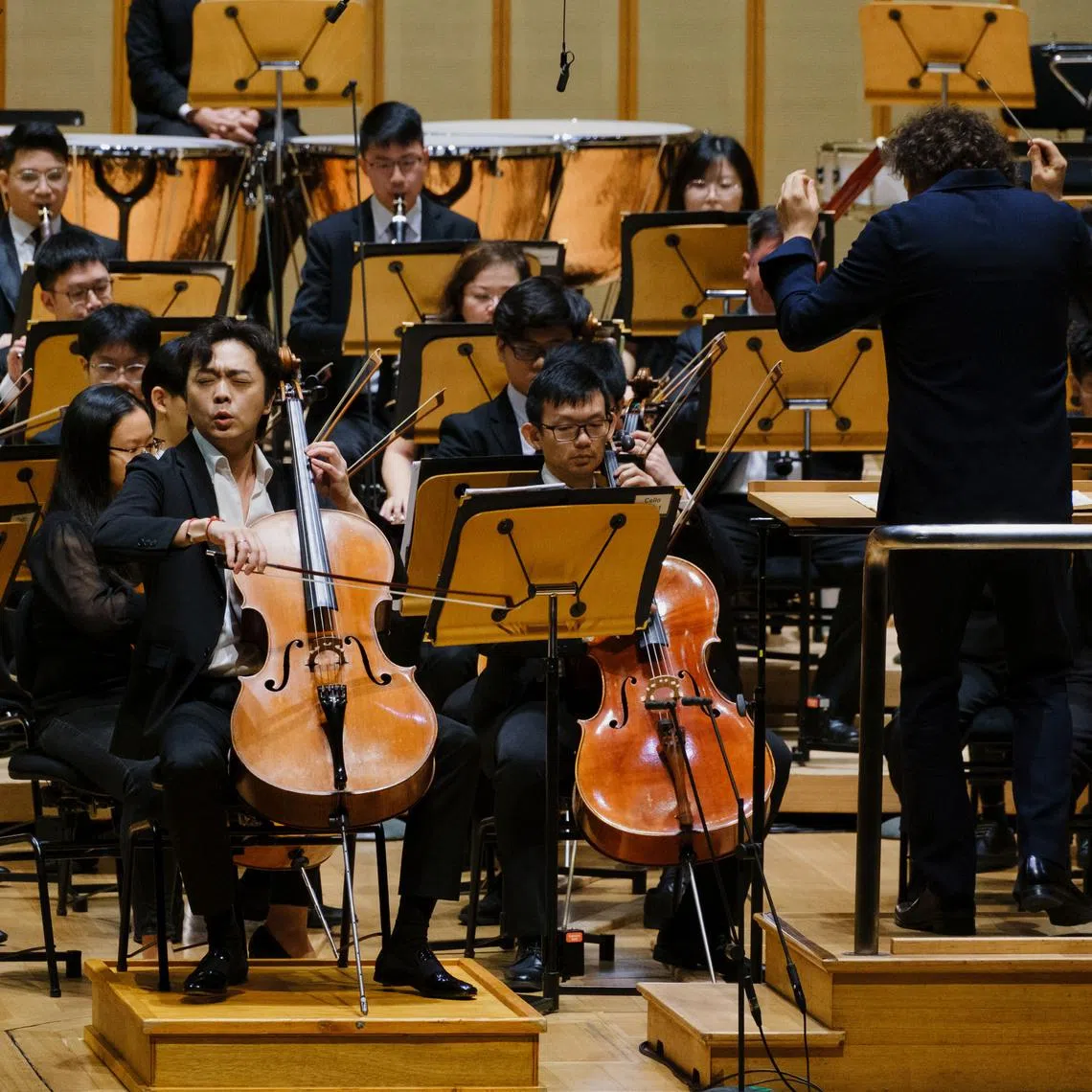 Cellist Qin Li-Wei played with the Orchestra Of The Music Makers under the guidance of guest French conductor Alexandre Bloch on May 29.
