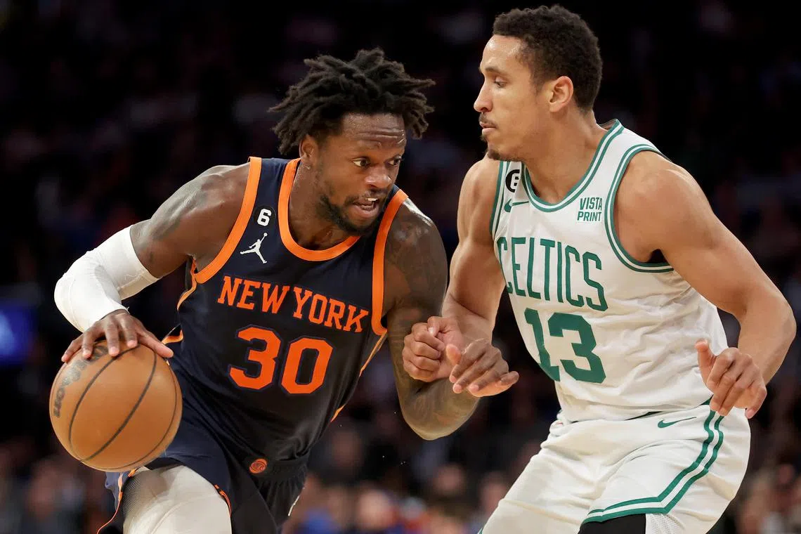 New York Knicks forward Julius Randle driving to the basket against Boston Celtics guard Malcolm Brogdon at Madison Square Garden. New York won 109-94.
