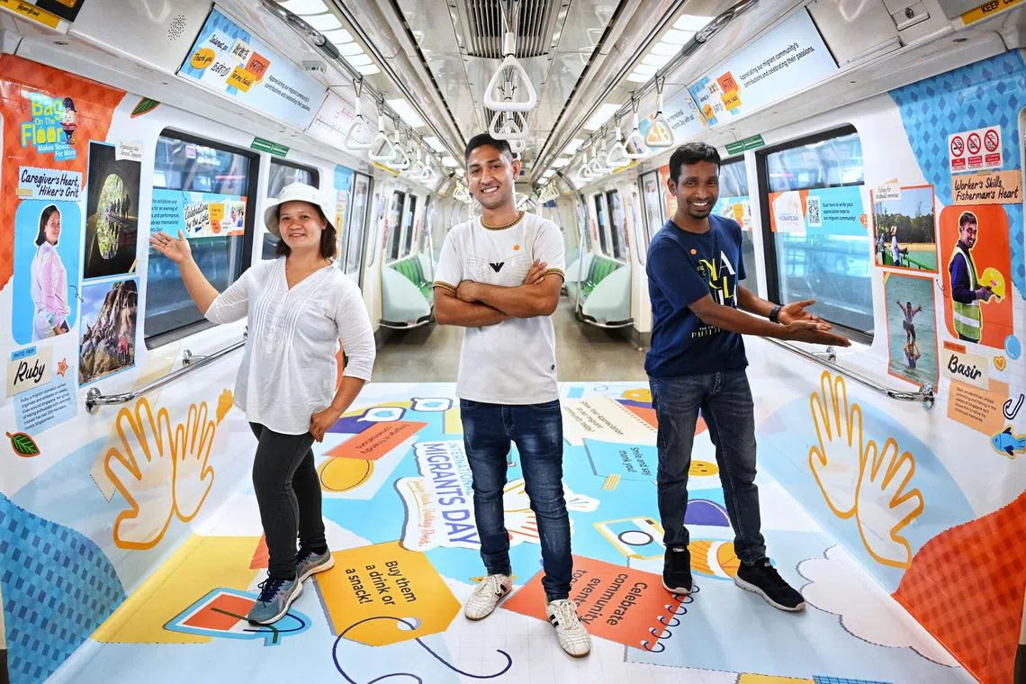 (From left) Migrant workers Quijano Ruby Ledesma, Mohammead Ashik Hossen and Basir Uddin at the launch of concept train at Ang Mo Kio MRT station on Dec 9.