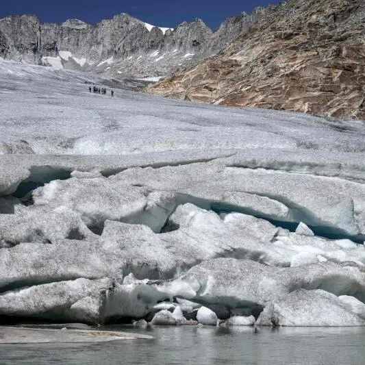 A photograph showing melt-induced crevasses on the lower part of the Rhone Glacier, above Gletsch in the Swiss Alps, on July 24, amid extreme heat.