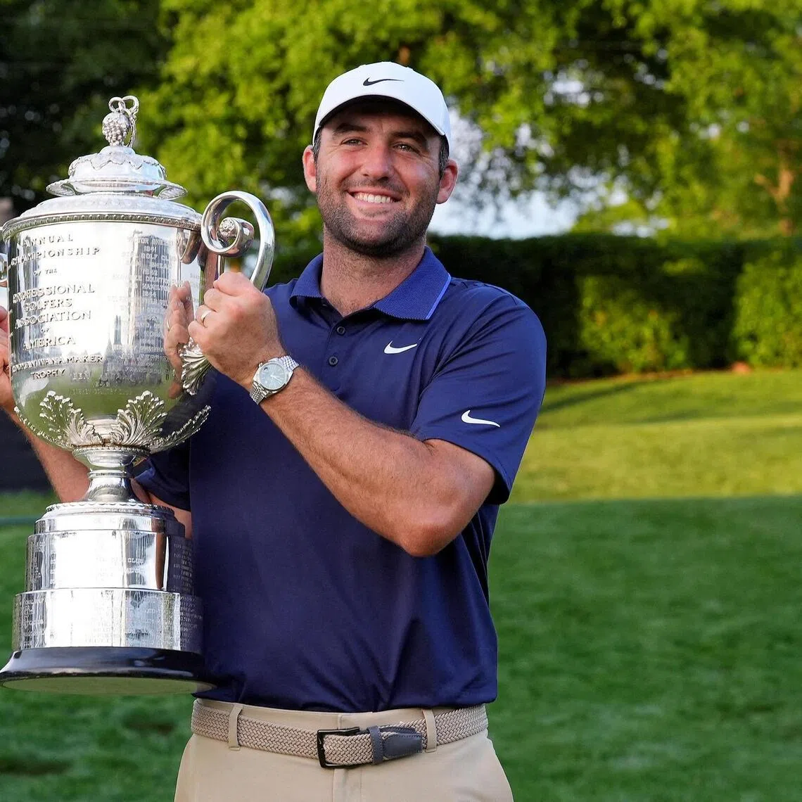 Scottie Scheffler poses for a photo with the Wanamaker Trophy after winning the PGA Championship golf tournament at Quail Hollow.
