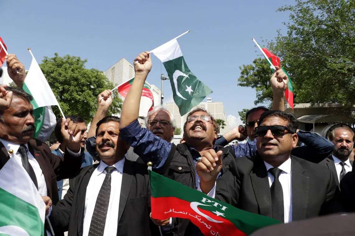 Supporters of Khan's Tehreek-e-Insaf party celebrate after the Supreme Court overturned the Election Commission's decision to postpone elections in Punjab  province.
