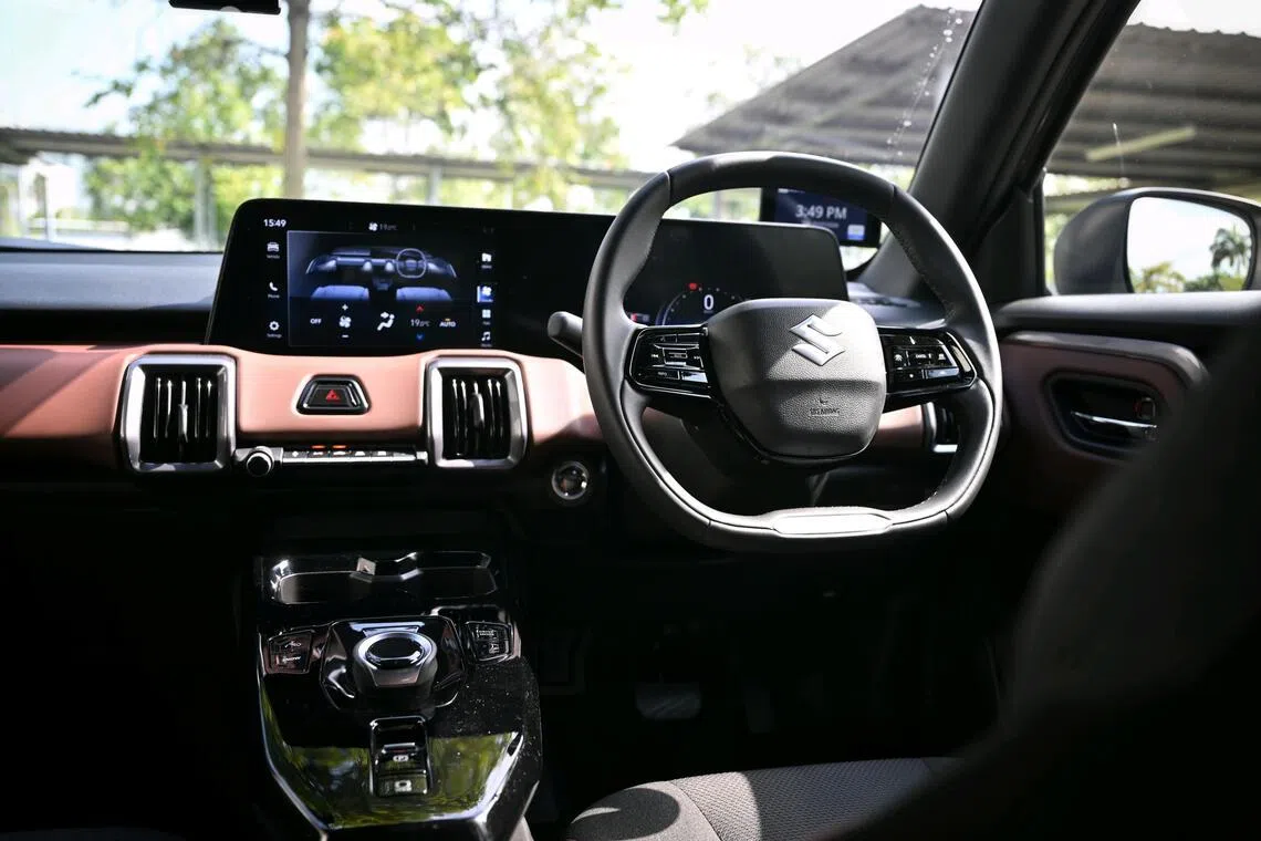 While short on frills, the car’s helm is contemporary, suitably digital, and has a rotary drive selector.