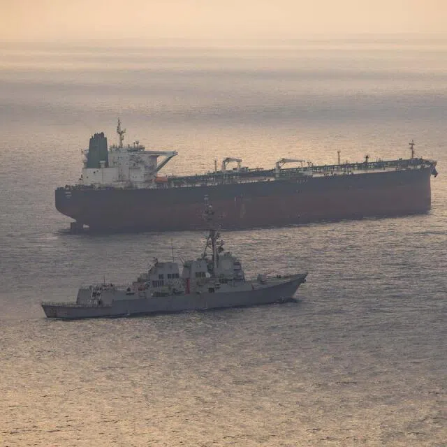 USS Rafael Peralta near what the US Central Command said was a vessel attempting to sail to an Iranian port, as it enforces the US blockade on Iranian ports, in an image released on April 24.