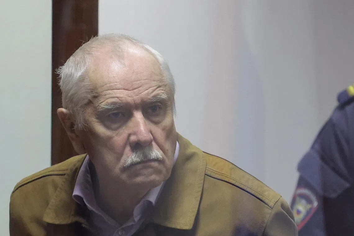 Russian physicist Anatoly Maslov, who was arrested in 2022 and accused of state treason, stands behind a glass wall of an enclosure for defendants before a court hearing in Saint Petersburg, Russia, May 21, 2024. REUTERS/Anton Vaganov